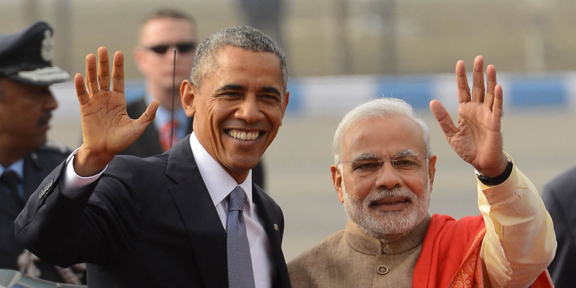 NEW DELHI, INDIA  JANUARY 26: Prime Minister Narendra Modi with visiting US President Barack Obama waves upon his  arrival in New Delhi.(Photo by Shekhar Yadav/India Today Group/Getty Images)